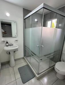 a bathroom with a shower and a toilet and a sink at Casa Privada en Zona Cantera in Chihuahua +14 photos