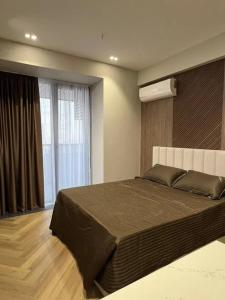 Postel nebo postele na pokoji v ubytování NRG U TOWER-Tashkent city