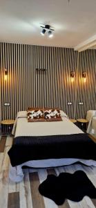 Ένα ή περισσότερα κρεβάτια σε δωμάτιο στο Junior Suites con Jacuzzi