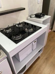 a white stove top oven in a kitchen at Apartamento compartilhado em Guarapuava - Quarto 3 in Guarapuava +54 photos
