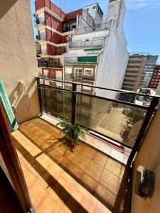 a balcony with a view of a building at Amardel in Mar del Plata