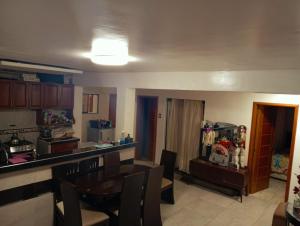 a kitchen and dining room with a table and chairs at Colibri - Hab Doble in Lima