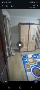 a view of a kitchen with a stove in a room at غرفتين في شقة in Zayyān