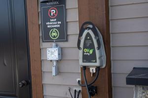 a parking meter on the side of a house at 2 bedroom condo Ski in Ski out Sommets St-Sauveur in Saint-Sauveur-des-Monts