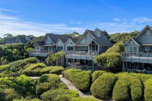 a row of houses on a hill with bushes at SS3559: 3559 Seascape in Kiawah Island