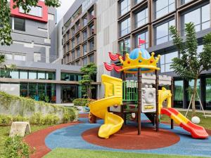 a playground with a slide in a park at ibis Styles Batam Nagoya in Nagoya
