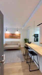a living room with a table and a couch at Timeless - O`Clock in Lisbon