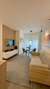 a living room with a couch and a table at Timeless - O`Clock in Lisbon