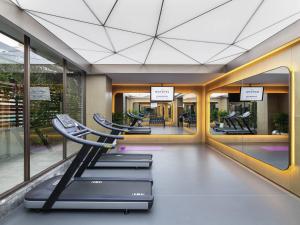a gym with a row of treadmills at Novotel Xi'an The Bell Tower in Xi'an