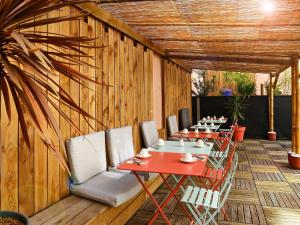 a row of tables and chairs in a restaurant at Mercure Toulouse Centre Wilson Capitole in Toulouse