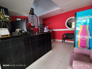 a restaurant with a soda bottle on the counter at Hotel Madeleine Inn Sede Sur in Barranquilla