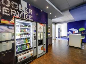 a vending machine in a store with drinks at ibis budget Winterthur in Winterthur