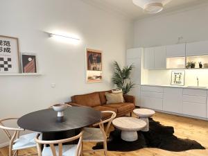 a living room with a table and a couch at Berlin & Friends in Berlin