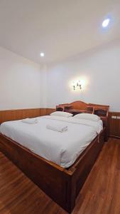 Ένα ή περισσότερα κρεβάτια σε δωμάτιο στο Home 24 Pattaya