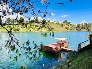 a wooden dock on a lake on a clear day at Exclusive Villa - Lake View - Forest in La Pradera