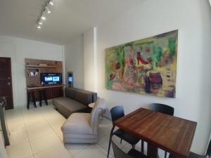 TV a/nebo společenská místnost v ubytování Home Carijós