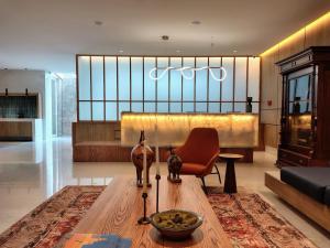 a living room with a couch and a table at Hotel Soretti in Durango
