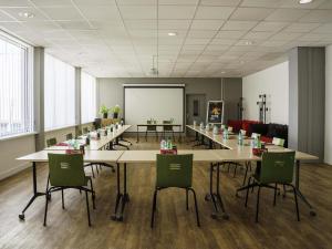 a large conference room with a long table and chairs at Ibis Alès Centre Ville in Alès