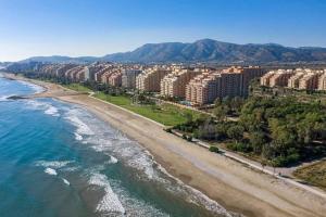 an aerial view of a beach with buildings and the ocean at Oropesa summer in Oropesa del Mar