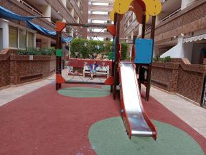 a playground in a building with a slide at Oropesa summer in Oropesa del Mar