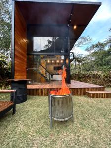 a fire pit in the backyard of a house at Chalé Industrial Pedra do Imperador in Nova Friburgo