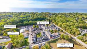 an aerial view of a parking lot with trees and the ocean at Spacious Dog-Friendly Getaway with Year-Round Pool & Hot Tub in South Haven +67 photos