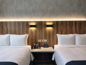 Ένα ή περισσότερα κρεβάτια σε δωμάτιο στο Hotel Soretti