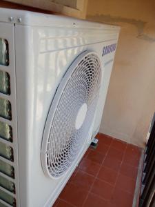 a white washing machine sitting in a room at Valencia Port Saplaya in Port Saplaya