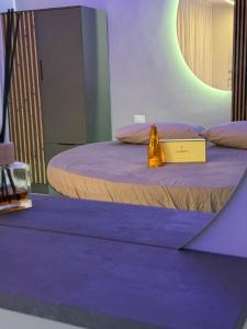 a room with two beds with a sign on it at SN Luxury Room & Spa in Foggia
