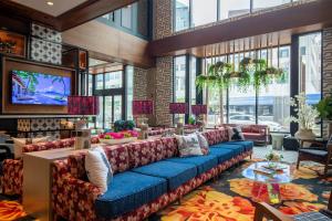 a lobby with couches and a television in a building at Luxury Apt In The Heart Of The Theater District in Cleveland