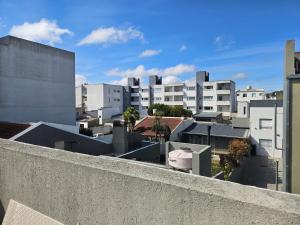 a view of a city with white buildings at El Cerrito in Tandil