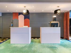 an office with two white desks in a room at ibis Lyon Part Dieu Les Halles in Lyon