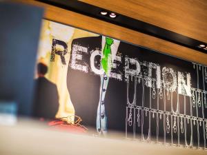 a book with a tie and the word freedom on it at ibis budget Strasbourg La Vigie in Ostwald