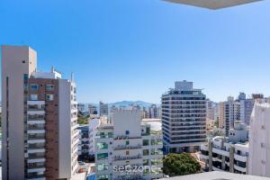 a view of a city with tall buildings at Lindo apto no centro Florianópolis RBH806 in Florianópolis
