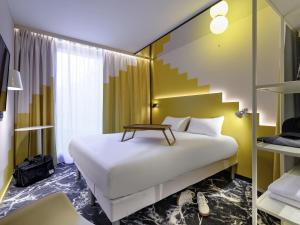 Postelja oz. postelje v sobi nastanitve ibis Styles Zurich City Center