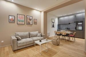 a living room with a couch and a table at New Apartment 2 bedrooms center of Paris by Studio prestige in Paris