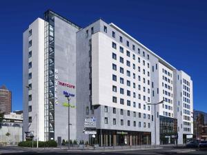 a white building with a sign on the side of it at Ibis Budget Lyon Centre - Gare Part Dieu in Lyon