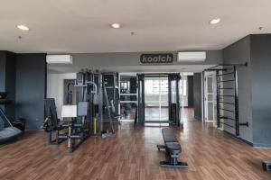 a gym with treadmills and ellipticals in a room at Prime Flat II - Metrópolis Alphaville in Barueri
