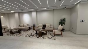 a living room with couches and chairs and a table at Villa from Al Essam Development with private pool, jacuzzi and home cinema المجلس من ال عصام للتطوير مع المسبح والجاكوزي الخاص والهوم سينما in 6th Of October +54 photos