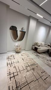 a living room with a couch and a rug at Villa from Al Essam Development with private pool, jacuzzi and home cinema المجلس من ال عصام للتطوير مع المسبح والجاكوزي الخاص والهوم سينما in 6th Of October