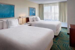 a hotel room with two beds and a window at Willow Grove Suites by IHG in Willow Grove +9 photos