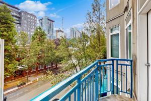 a balcony with a view of a city at The Starry Night of Belltown in Seattle