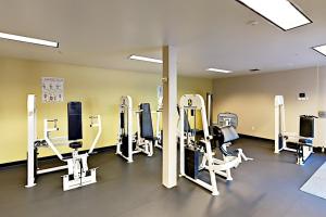 a gym with several treadmills and elliptical machines at The Starry Night of Belltown in Seattle