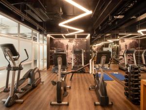 a gym with treadmills and elliptical machines at Novotel Santiago Vitacura in Santiago