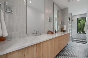 a large white bathroom with a large sink and a mirror at Heated Pool Luxury Zilker home Sleeps 8 great view in Austin