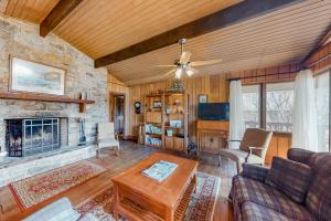 a living room with a couch and a fireplace at Morris Villa Upper in Lake Junaluska