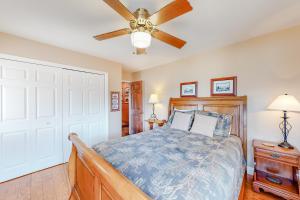 a bedroom with a bed and a ceiling fan at Morris Villa Upper in Lake Junaluska