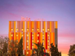 a building with a hotel sign on top of it at ibis Navi Mumbai - An Accor Brand in Navi Mumbai