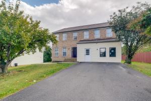 a large brick building with a white garage at Family Home Near UMD and Dtwn Silver Spring! in Adelphi