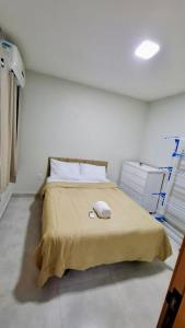 a bedroom with a bed in a white room at Apartamento aconchegante completo -Próximo ao Aeroporto-COP30 in Belém +12 photos